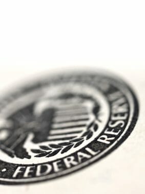 Very Tightly Cropped Image Of A Dollar Bill With Selected Focus On The Federal Reserve Official Symbol