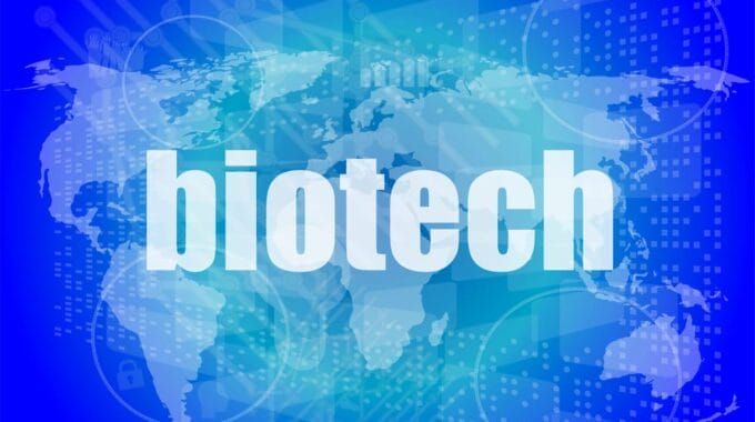 Biotech over blue world map with hi-tech theme
