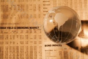 Bond Yields on Newspaper with Glass Globe