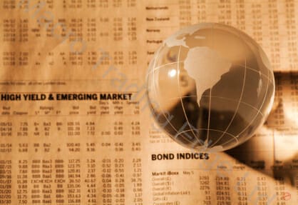 Bond Yields on Newspaper with Glass Globe