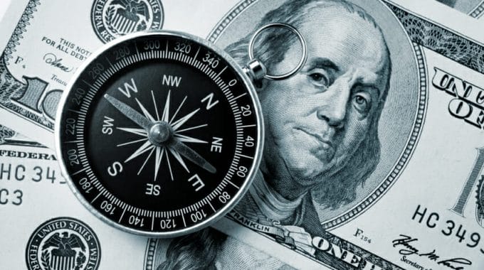 Compass On Hundred Dollar Background