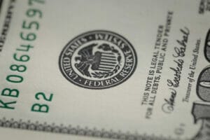 Photo Of Federal Reserve System Symbol On Hundred Dollar Bill